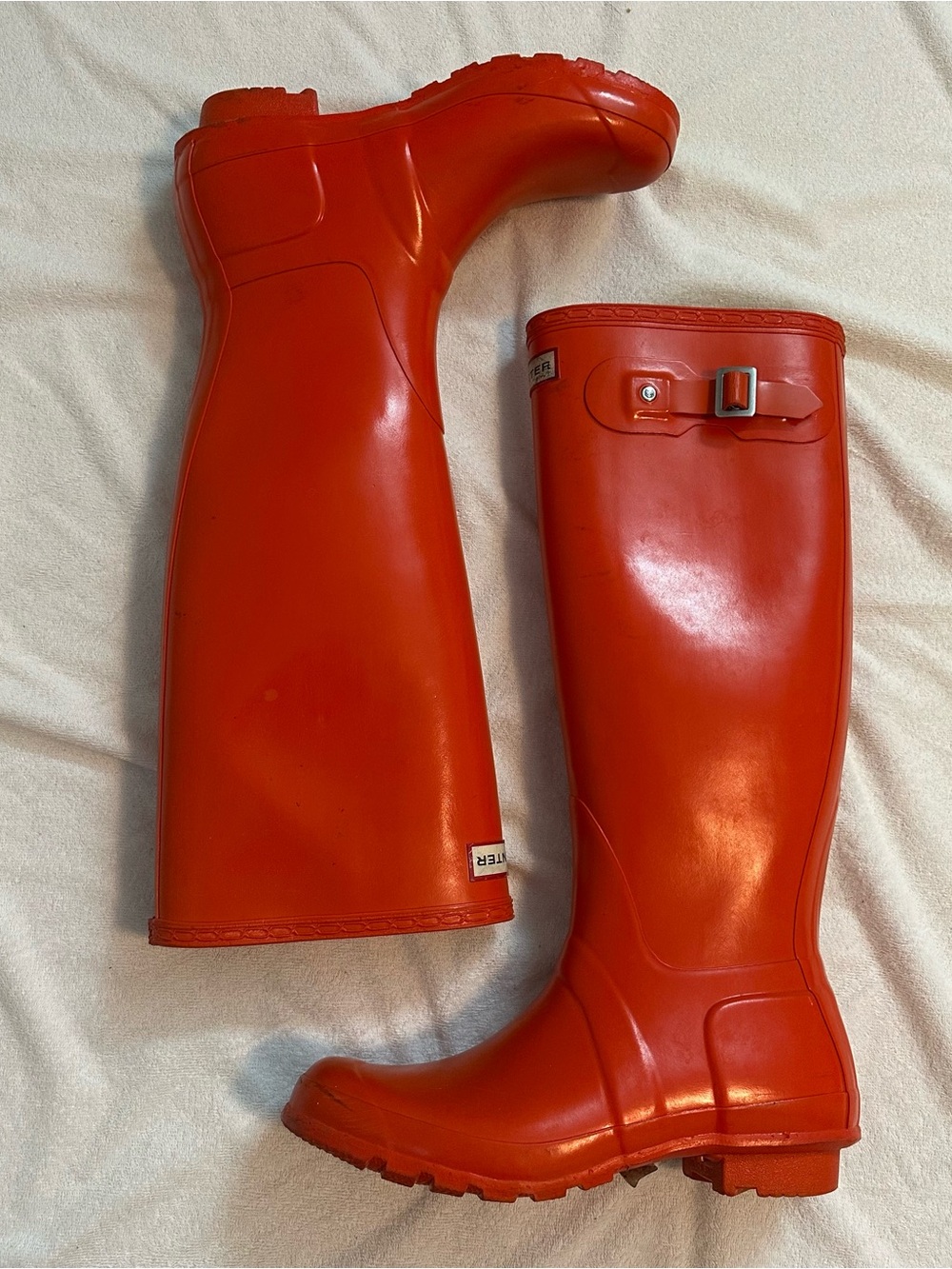 Glossy orange tall hunter rainboots